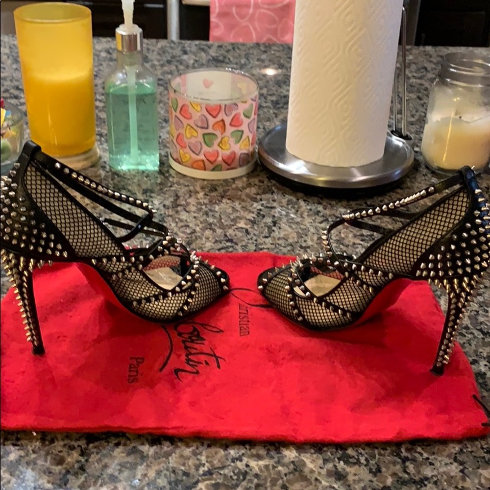 Black and silver studded red bottoms